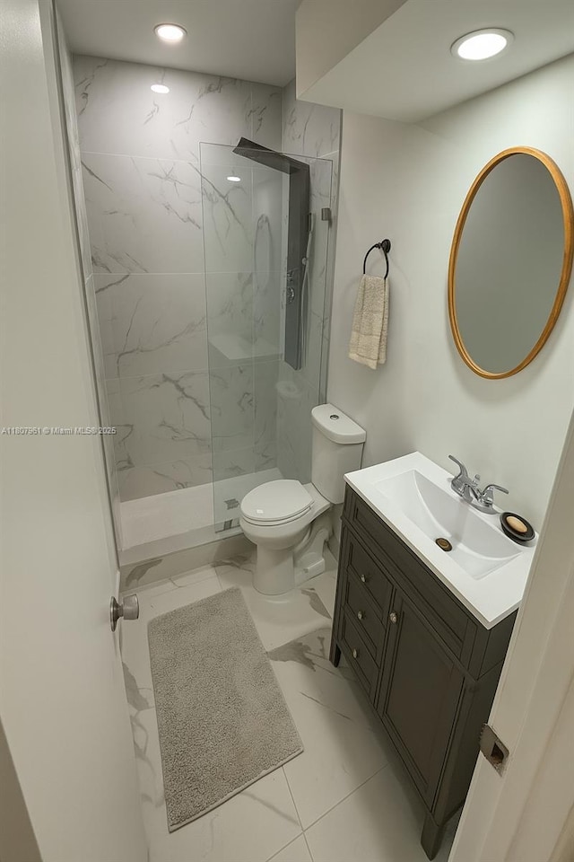630 Layne Blvd Unit 211, Hallandale Beach, FL 33009 - full bath with marble look tile flooring, a marble finish shower, vanity, and recessed lighting