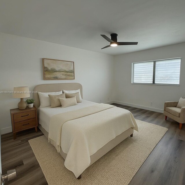 630 Layne Blvd Unit 211, Hallandale Beach, FL 33009 - bedroom featuring dark wood finished floors and ceiling fan