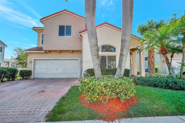 1874 NW 74th Way, Pembroke Pines, FL 33024 - mediterranean / spanish house featuring stucco siding, a tiled roof, an attached garage, and decorative driveway