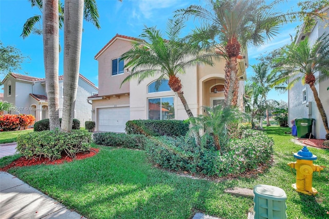 1874 NW 74th Way, Pembroke Pines, FL 33024 - mediterranean / spanish-style house with a garage, stucco siding, and a front lawn