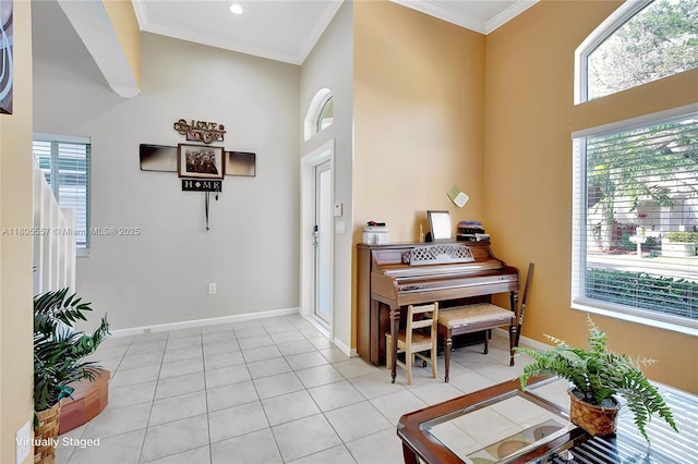 1874 NW 74th Way, Pembroke Pines, FL 33024 - entrance foyer with healthy amount of natural light, a high ceiling, baseboards, light tile patterned flooring, and ornamental molding