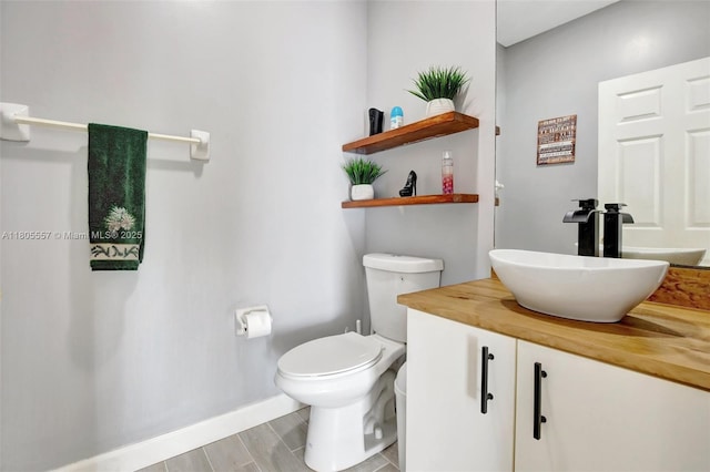 1874 NW 74th Way, Pembroke Pines, FL 33024 - bathroom featuring vanity, toilet, and baseboards