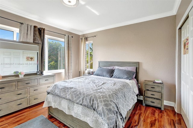 1874 NW 74th Way, Pembroke Pines, FL 33024 - bedroom featuring wood finished floors, crown molding, and baseboards
