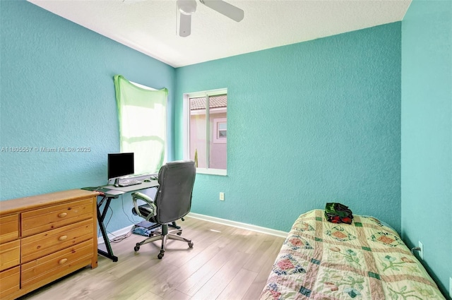1874 NW 74th Way, Pembroke Pines, FL 33024 - home office featuring a textured wall, wood finished floors, a ceiling fan, and baseboards
