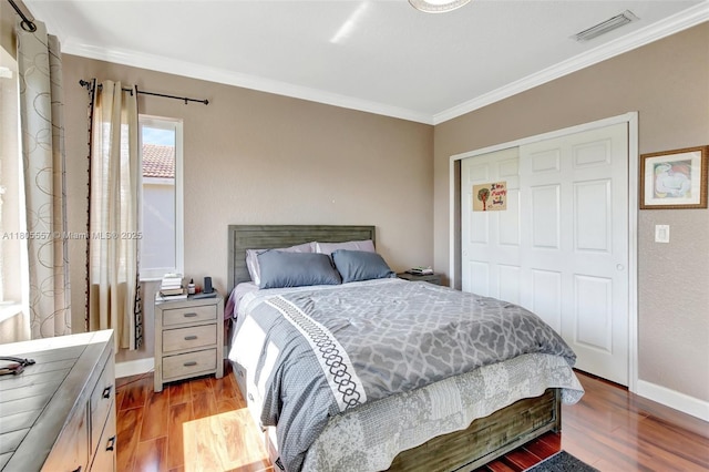 1874 NW 74th Way, Pembroke Pines, FL 33024 - bedroom with ornamental molding, wood finished floors, a closet, and baseboards