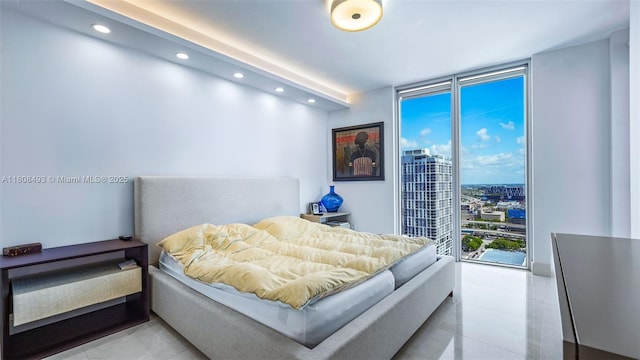 185 SW 7th St Unit 2911, Miami, FL 33130 - bedroom with a wall of windows, recessed lighting, and tile patterned floors