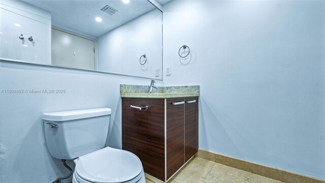 185 SW 7th St Unit 2911, Miami, FL 33130 - half bathroom with vanity and tile patterned flooring