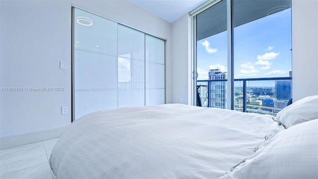 185 SW 7th St Unit 2911, Miami, FL 33130 - tiled bedroom with a view of city and a closet