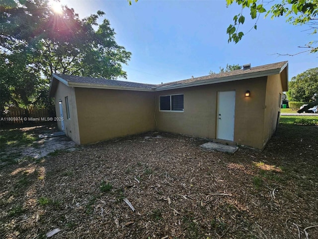 5960 NW 14th St, Sunrise, FL 33313 - rear view of property with stucco siding