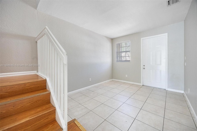 623 NE 21st Ter, Homestead, FL 33033 - entrance foyer with light tile patterned floors and baseboards