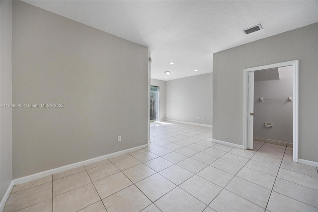 623 NE 21st Ter, Homestead, FL 33033 - spare room with light tile patterned floors, baseboards, and recessed lighting