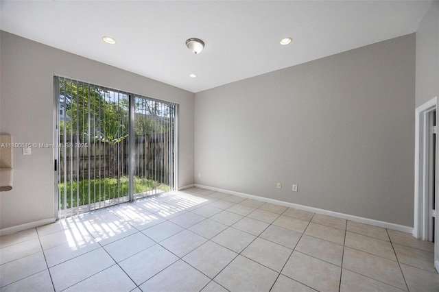 623 NE 21st Ter, Homestead, FL 33033 - tiled spare room featuring baseboards and recessed lighting