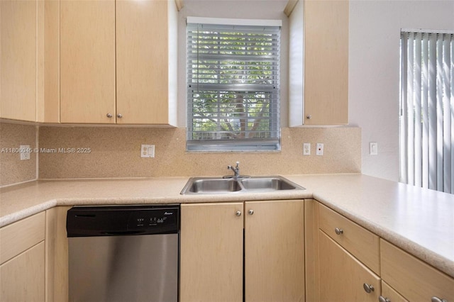 623 NE 21st Ter, Homestead, FL 33033 - kitchen featuring dishwasher, a sink, light brown cabinets, and light countertops