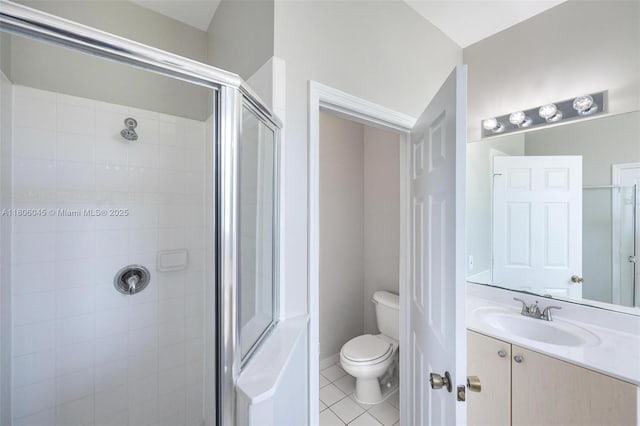 623 NE 21st Ter, Homestead, FL 33033 - bathroom with a stall shower, vanity, toilet, and tile patterned floors