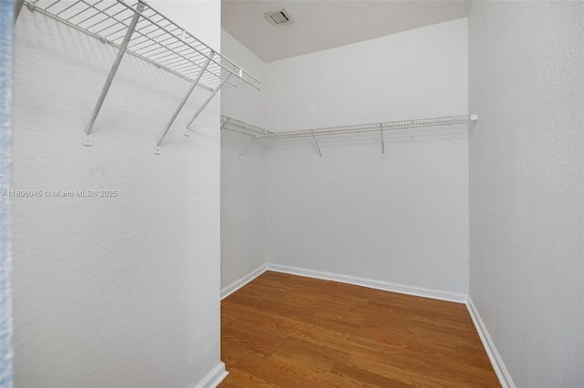 623 NE 21st Ter, Homestead, FL 33033 - spacious closet featuring wood finished floors