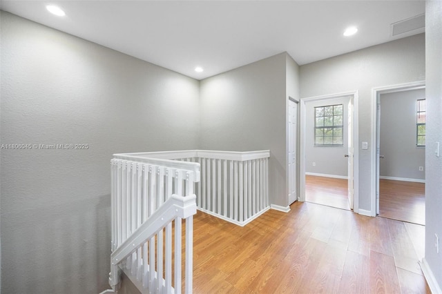 623 NE 21st Ter, Homestead, FL 33033 - hall with an upstairs landing, wood finished floors, baseboards, and recessed lighting