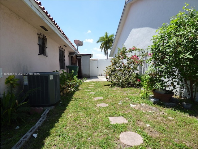 9023 NW 113th St, Hialeah Gardens, FL 33018 - view of yard with central air condition unit and a gate