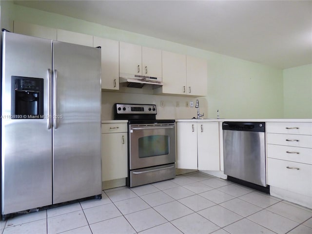 9023 NW 113th St, Hialeah Gardens, FL 33018 - kitchen with stainless steel appliances, under cabinet range hood, light countertops, a sink, and light tile patterned flooring