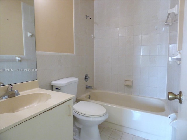 9023 NW 113th St, Hialeah Gardens, FL 33018 - bathroom with toilet, vanity, shower / bathtub combination, tile patterned flooring, and tile walls