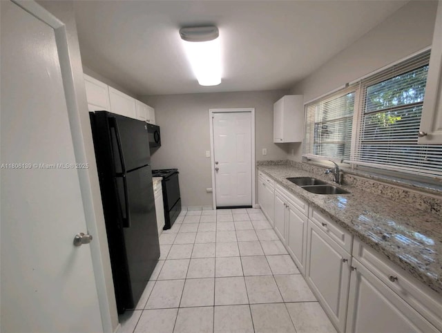 7911 SW 132nd Ave, Miami, FL 33183 - kitchen featuring black appliances, a sink, white cabinets, and light tile patterned floors