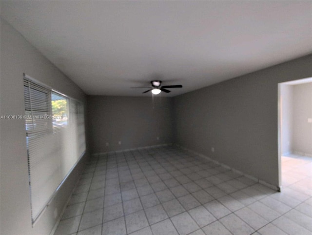 7911 SW 132nd Ave, Miami, FL 33183 - spare room with ceiling fan, light tile patterned flooring, and baseboards