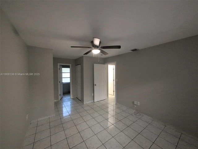 7911 SW 132nd Ave, Miami, FL 33183 - empty room featuring light tile patterned flooring, a ceiling fan, and baseboards