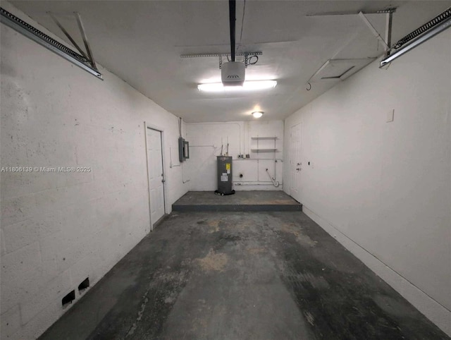 7911 SW 132nd Ave, Miami, FL 33183 - garage featuring water heater, electric panel, and a garage door opener