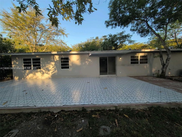 7911 SW 132nd Ave, Miami, FL 33183 - rear view of house featuring a patio area and stucco siding