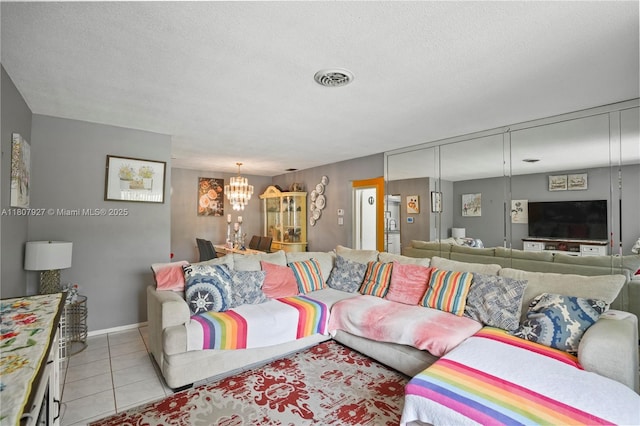 5390 SW 10th Ct, Margate, FL 33068 - tiled living area featuring a chandelier, a textured ceiling, and baseboards
