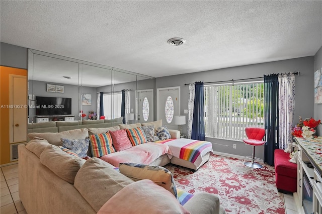 5390 SW 10th Ct, Margate, FL 33068 - living room with light tile patterned floors and a textured ceiling