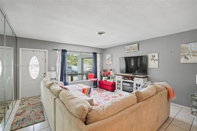 5390 SW 10th Ct, Margate, FL 33068 - living area with light tile patterned floors and a textured ceiling