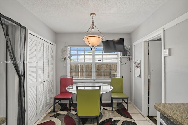 5390 SW 10th Ct, Margate, FL 33068 - dining space with a textured ceiling, baseboards, and light tile patterned floors