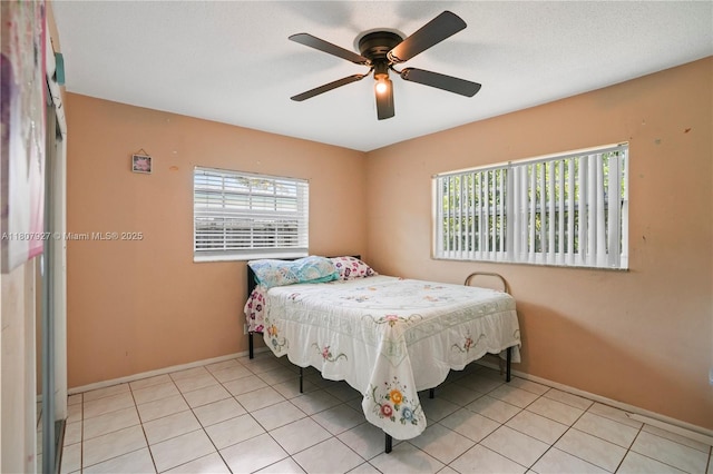 5390 SW 10th Ct, Margate, FL 33068 - bedroom featuring baseboards, light tile patterned flooring, and a ceiling fan