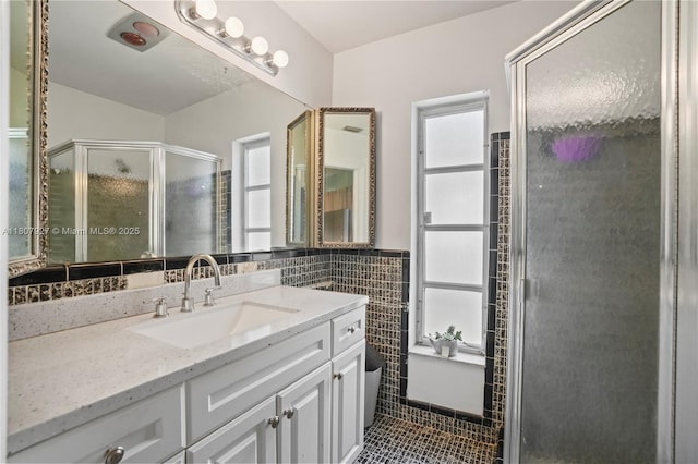 5390 SW 10th Ct, Margate, FL 33068 - full bathroom featuring tile walls, vanity, tile patterned floors, and a stall shower