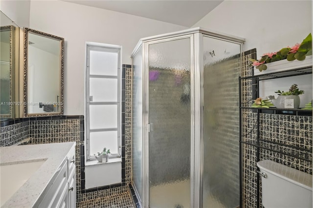 5390 SW 10th Ct, Margate, FL 33068 - full bath featuring tile walls, vanity, toilet, a stall shower, and tile patterned flooring