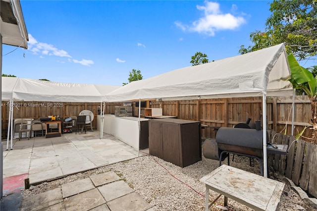 5390 SW 10th Ct, Margate, FL 33068 - fenced backyard with a patio and exterior kitchen