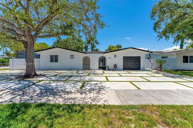 9304 SW 166th Ter, Palmetto Bay, FL 33157 - single story home featuring a garage, stucco siding, and concrete driveway