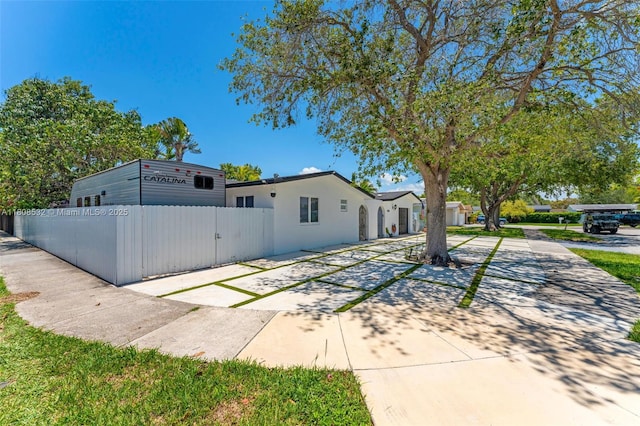 9304 SW 166th Ter, Palmetto Bay, FL 33157 - view of front facade with a gate and stucco siding