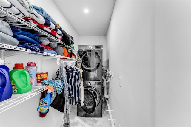 9304 SW 166th Ter, Palmetto Bay, FL 33157 - laundry room with stacked washing machine and dryer, marble finish flooring, and recessed lighting