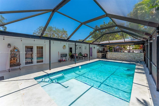 9304 SW 166th Ter, Palmetto Bay, FL 33157 - outdoor pool with a patio area, french doors, and glass enclosure