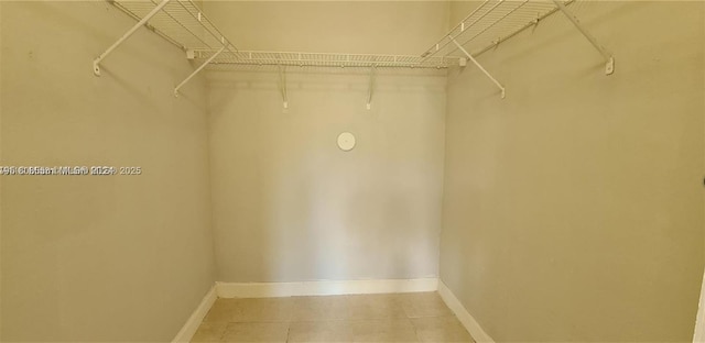2903 SE 17th Ave Unit 102, Homestead, FL 33035 - spacious closet featuring light tile patterned floors
