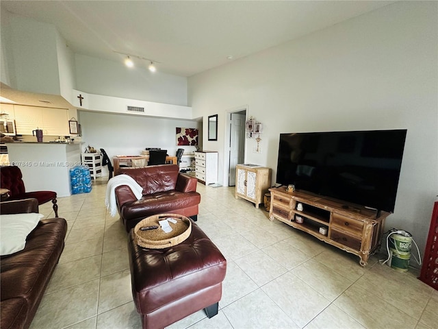 5031 Wiles Rd Unit 304, Coconut Creek, FL 33073 - living room with rail lighting, light tile patterned floors, a high ceiling, and an office area