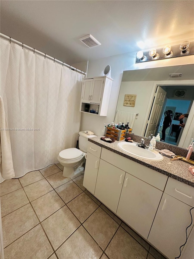 5031 Wiles Rd Unit 304, Coconut Creek, FL 33073 - full bathroom with vanity, toilet, and tile patterned floors
