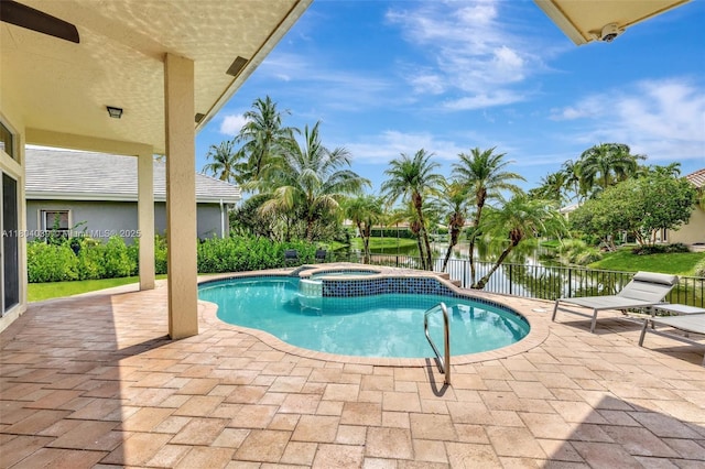 10881 Hawks Vista St, Plantation, FL 33324 - view of pool with a patio area, a water view, and a pool with connected hot tub