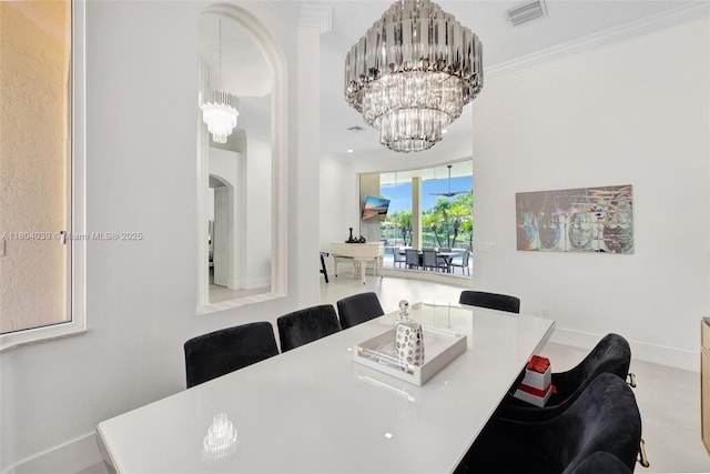 10881 Hawks Vista St, Plantation, FL 33324 - dining room with a chandelier, arched walkways, baseboards, and ornamental molding