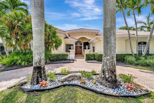10881 Hawks Vista St, Plantation, FL 33324 - mediterranean / spanish-style house featuring stucco siding and a tile roof