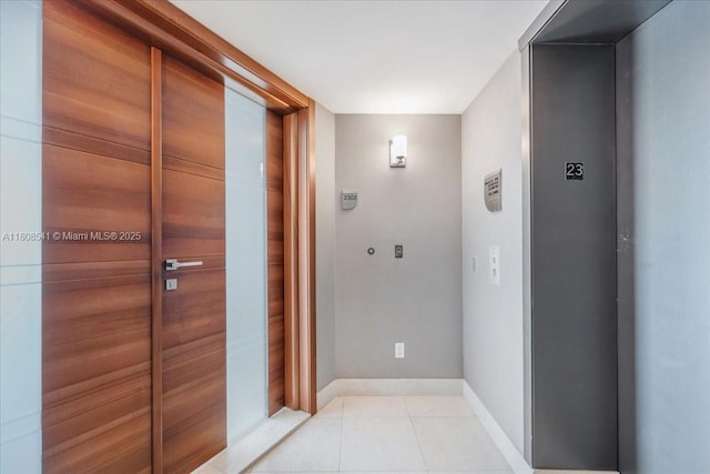 2127 Brickell Ave Unit 2302, Miami, FL 33129 - hallway with baseboards and light tile patterned floors