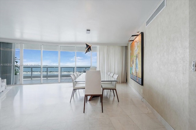 2127 Brickell Ave Unit 2302, Miami, FL 33129 - dining space with a water view and floor to ceiling windows