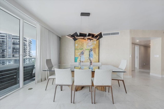 2127 Brickell Ave Unit 2302, Miami, FL 33129 - dining space with a chandelier