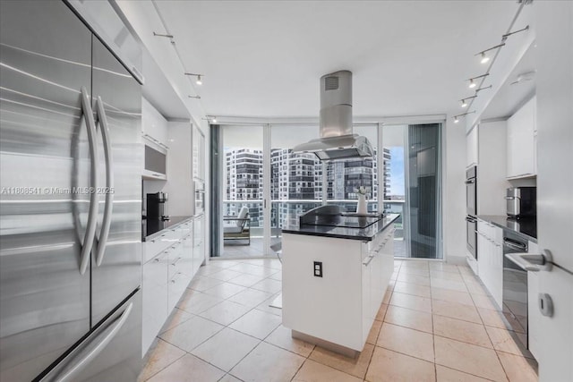 2127 Brickell Ave Unit 2302, Miami, FL 33129 - kitchen featuring appliances with stainless steel finishes, rail lighting, island exhaust hood, modern cabinets, and expansive windows